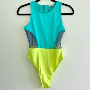 One piece high neck swimsuit, color block teal and neon yellow with mesh panels